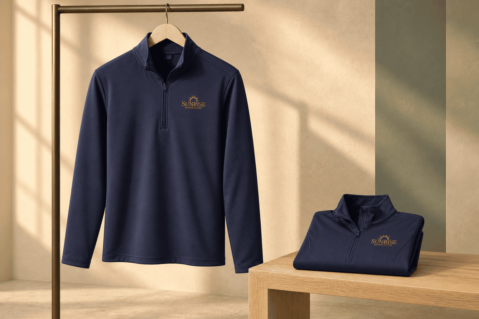 Sunrise Senior Living navy quarter-zips, hanging and folded