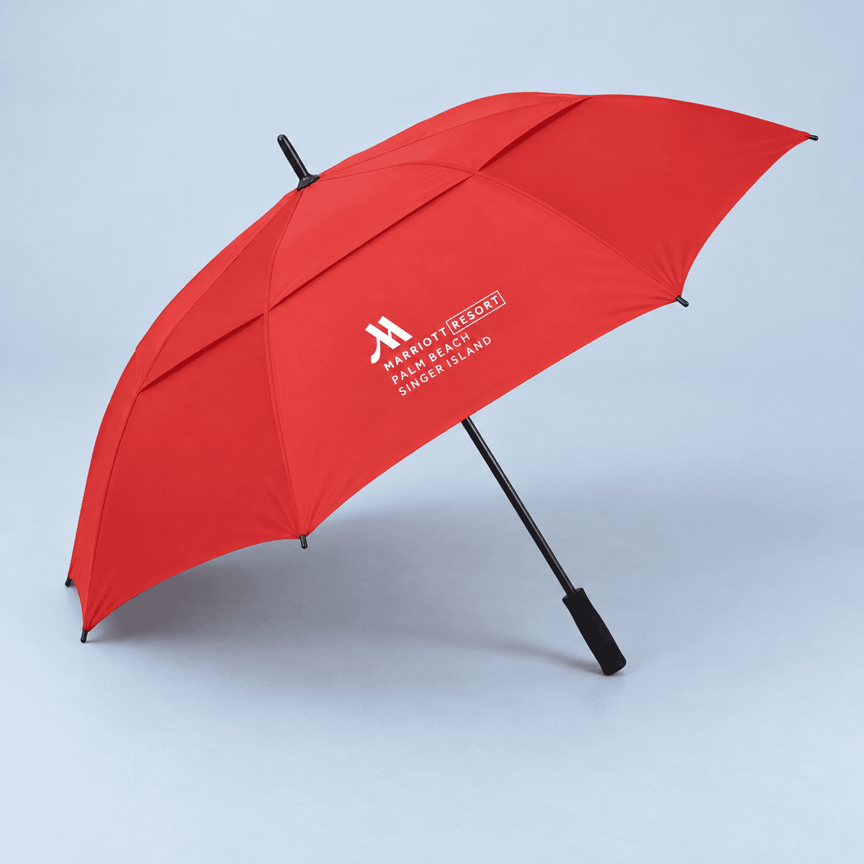 Red golf umbrella with a Marriott resort logo