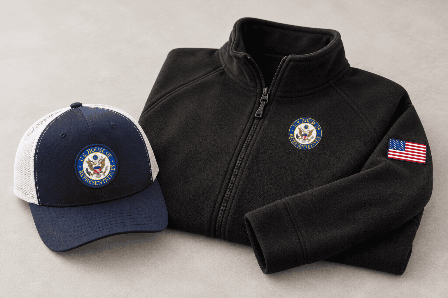 Embroidered black fleece jacket and trucker cap with the U.S. House of Representatives seal