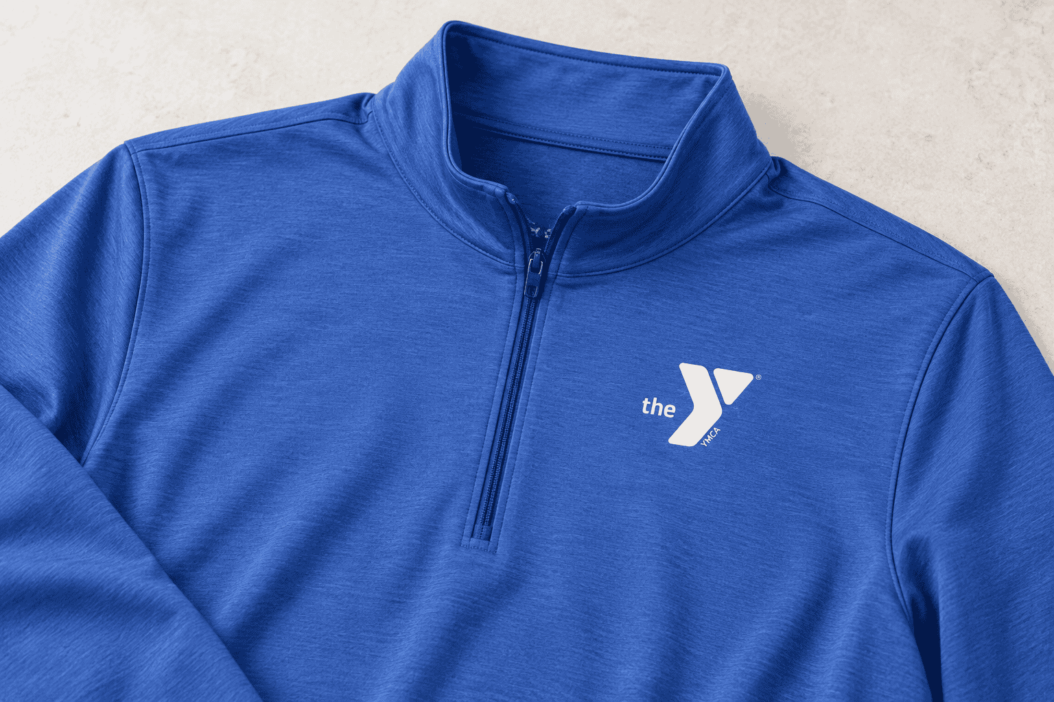 Royal blue YMCA quarter-zip, embroidered logo detail