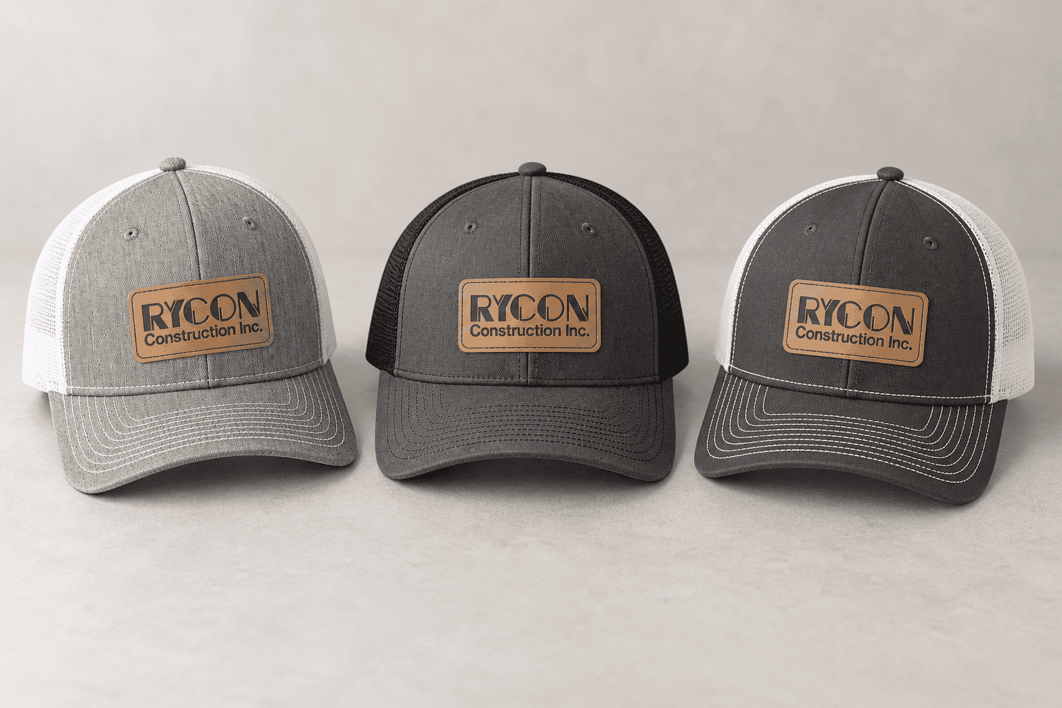 Three Rycon Construction trucker caps with leather patches